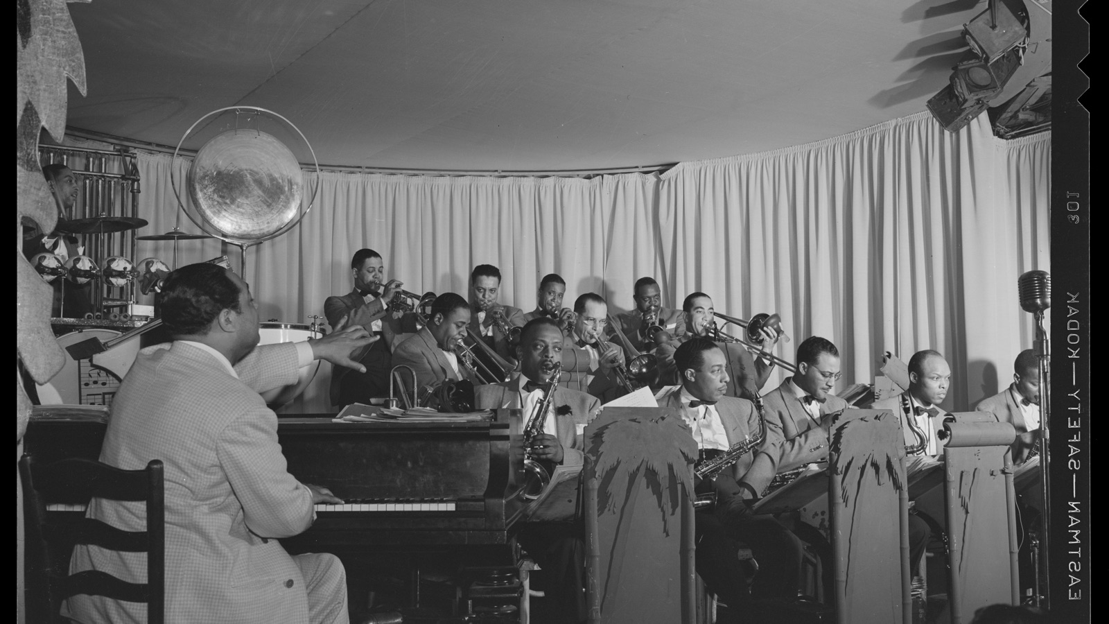 Black-and-white photograph of Duke Ellington directing his band from the piano in New York in 1943
