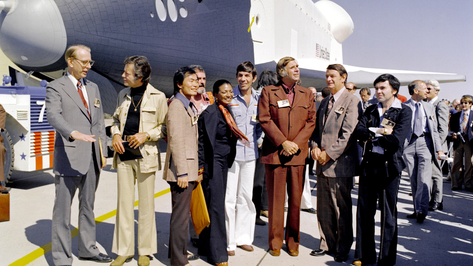 Star Trek cast members and creator Gene Roddenberry stand with NASA leaders in front of space shuttle Enterprise in 1976
