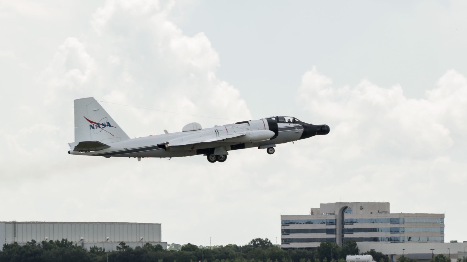 NASA’s white WB-57 research aircraft taking off from Ellington Field in Houston