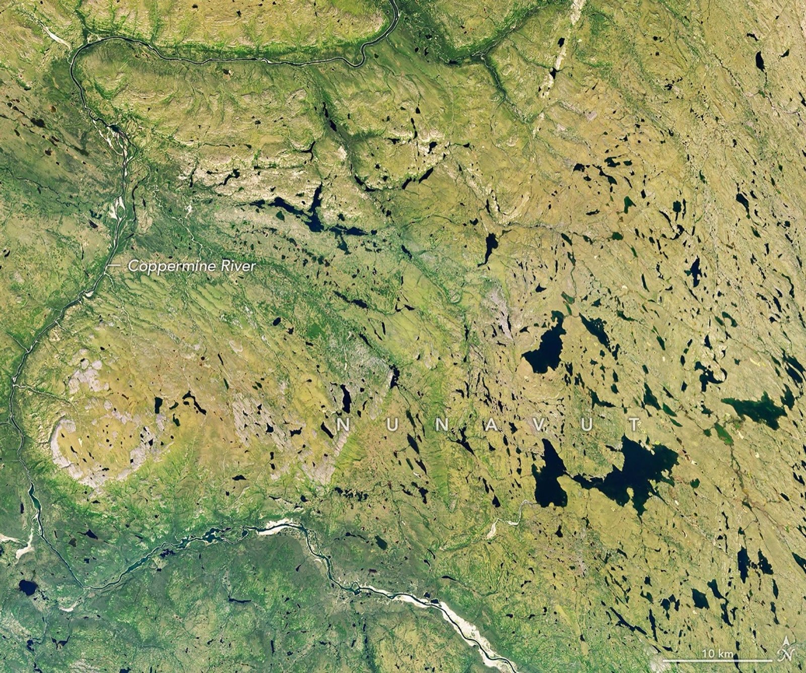 Landsat 9 view of the Coppermine River winding through mostly green summer tundra and dark lakes in Nunavut