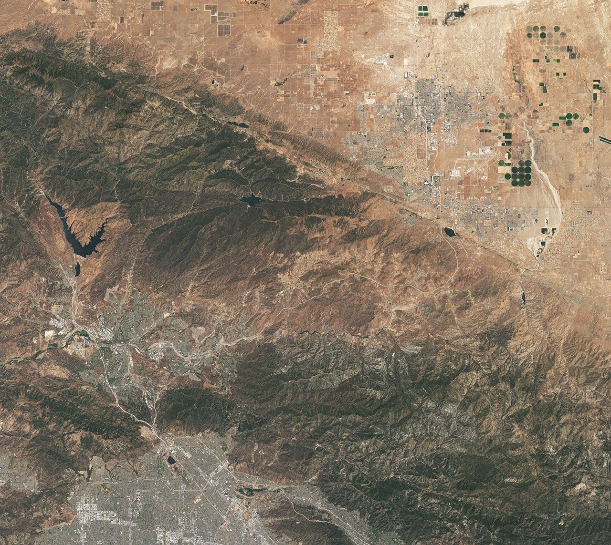Natural-color Landsat view of the same Southern California hills, with Vasquez Rocks appearing as subtle pale stripes near the center